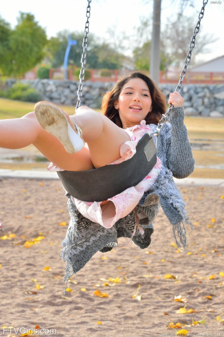 Attractive teenie Melody flaunts her delicious vagina and round ass in the park