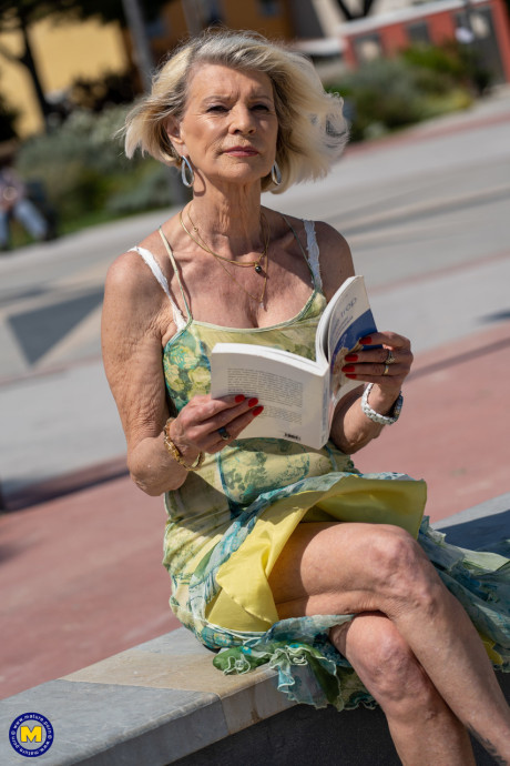 Yellow-haired granny Eva Delage exposes her lovely tasty melons and takes two cocks deeply