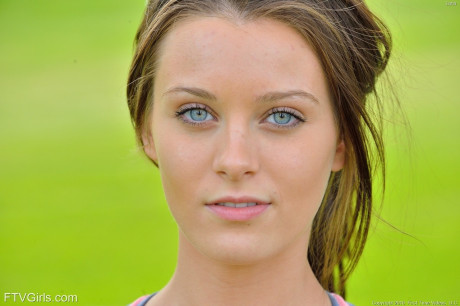 Fit girl lady strips off sports workout clothes to model naked on golf course