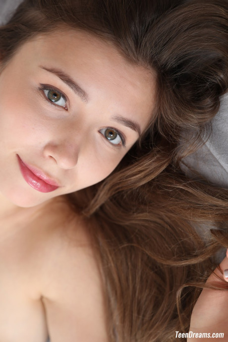 Pretty delicious Ukrainian babe Mila Azul teases with her beautiful large tits on her bed