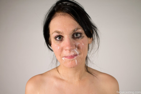 Dark haired amateur exposes her nice boobs and swallows a meat at a casting