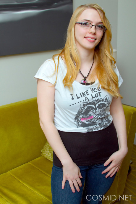 Slender glasses clad Sue Connor peeling her jeans and displaying her humongous boobies
