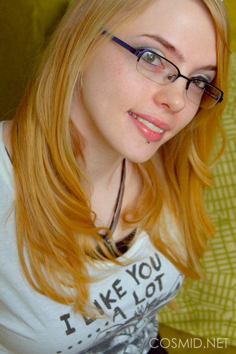 Slender glasses clad Sue Connor peeling her jeans and displaying her humongous boobies