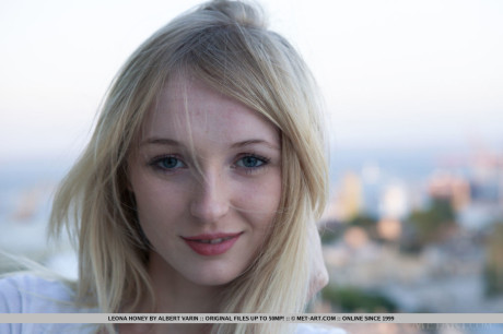 Blonde glamour babe Leona Honey revealing tiny young melons while stripping