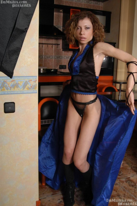 Teenie with small boobies Katya goes unclothed while dancing in the kitchenette