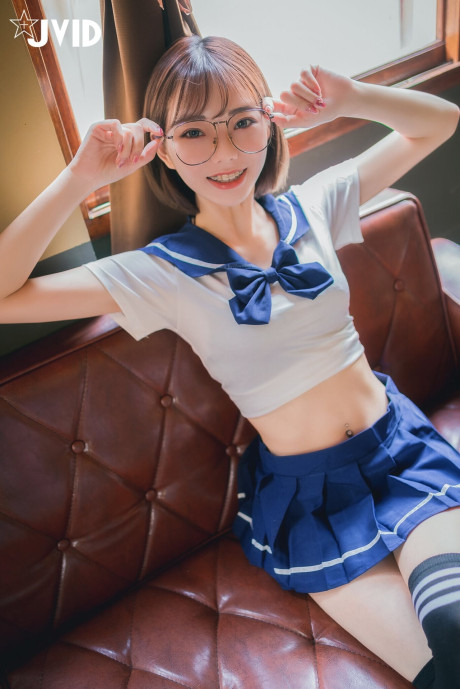 Japanese coed flashes her ebony panties while wearing her glasses