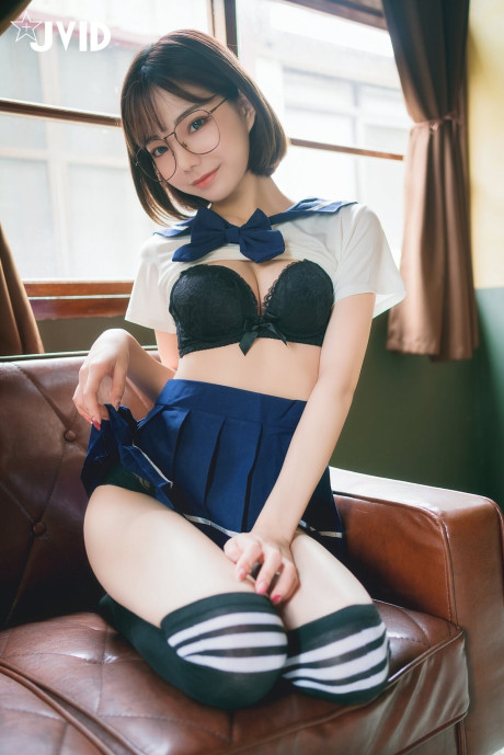 Japanese coed flashes her ebony panties while wearing her glasses