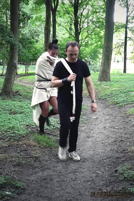 Young young brunette slave is disciplined and slammed in the forest by her Master