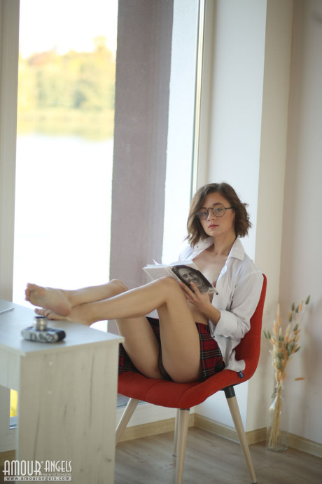 First timer Katrina peers over her glasses prior to getting bare undressed
