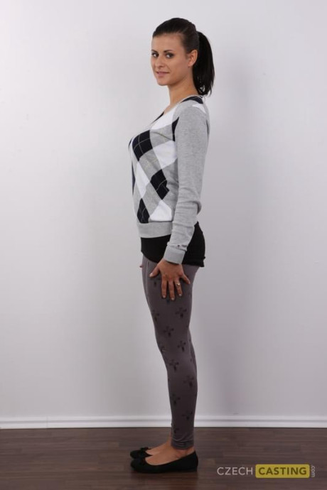 Brunette amateur removes leggings and underwear to stand undressed in a ponytail
