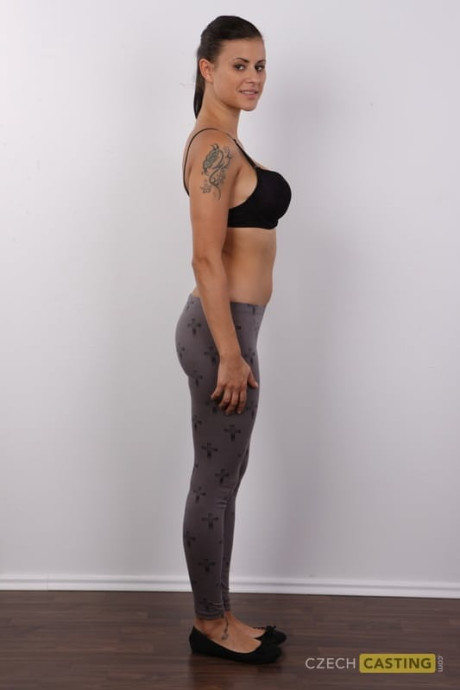 Brunette amateur removes leggings and underwear to stand undressed in a ponytail