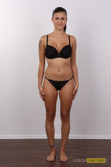 Brunette amateur removes leggings and underwear to stand undressed in a ponytail