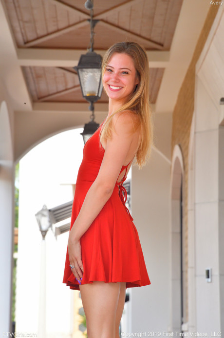 Adorable amateur teen in a red dress Avery flashes her bum and twat