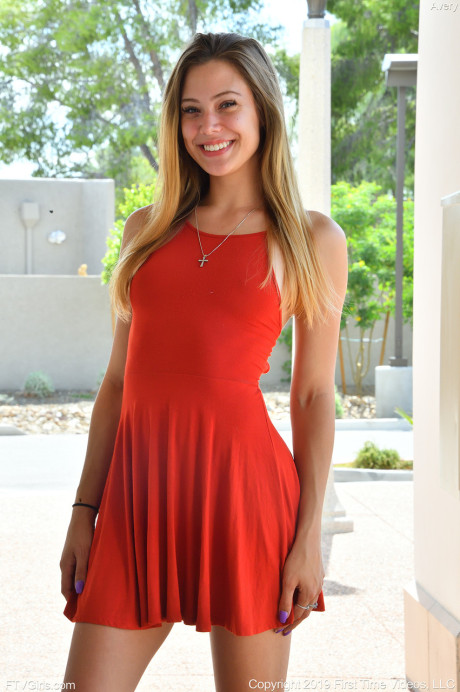 Adorable amateur teen in a red dress Avery flashes her bum and twat