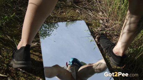 Hot blondy sprays her pee streams over a mirror