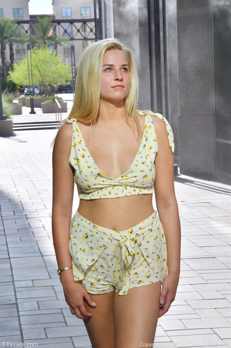 Delightful ten Sophia reveals her tiny melons and poses in public