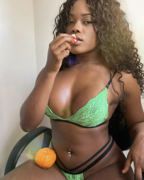 Ravishing black babe shows off her enormous butt & her ravishing titties in undies