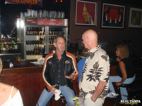 Yellow-haired amateur cougar shows her shaved clam in the swinger night club