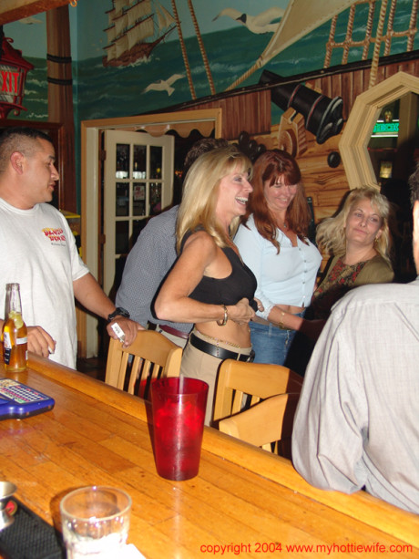 Naughty cougar American wives reveal their massive melons at a swingers party