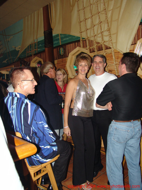 Naughty cougar American wives reveal their massive melons at a swingers party