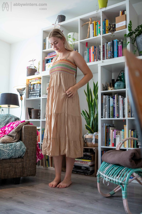 Curvy amateur teenie Denise D teases with her curves while changing her clothes