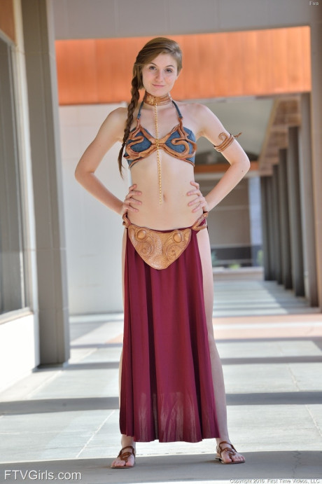 Adorable teen in a princess costume Eva toys her pussy in public