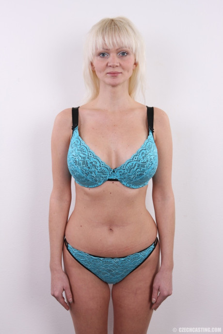 Blondie amateur with humongous breasts removes her clothes in a solo show