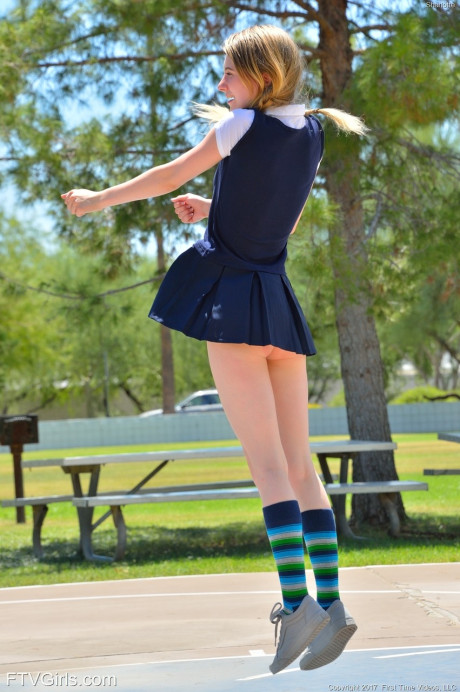 Thin pantyless teen Sharlotte flashing her clit in public and stripping