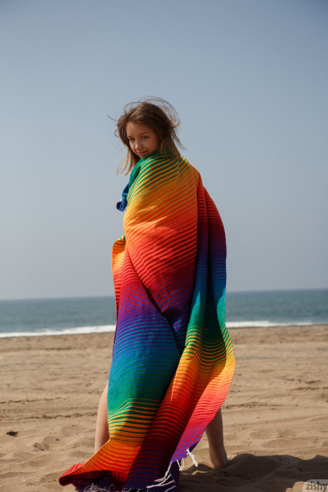 Flexible teen Aurora Zvezda gets nasty and naked on the beach