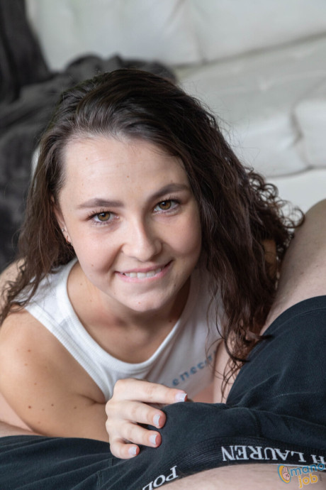 Attractive college lady girl chick Liz Jordan takes a facial while giving a POV handjob