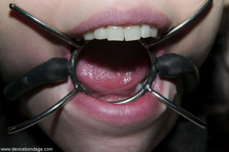 Fresh teenie sub Kristine restrained with chains for punishment in metal bondage BDSM