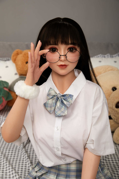 Lovely asian sex doll with pigtails Linda Lizzie posing in her schoolgirl outfit