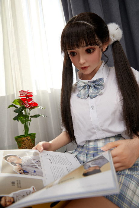 Lovely asian sex doll with pigtails Linda Lizzie posing in her schoolgirl outfit