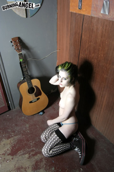 Goth misfit Rubella loses her clothes to display her soft body and perky titties