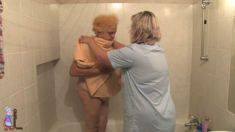 BBW old lady Clara lets her lesbian caregiver finger her horny cunt