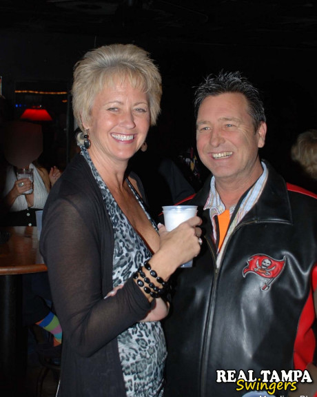 Mature swinger Tracy lick reveals her large juggs and gets blacked at a club