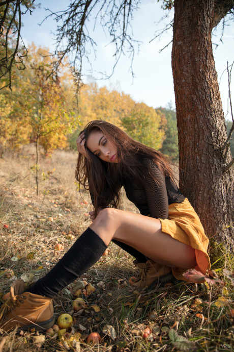 Brunette teen Sabrisse exposes her trimmed snatch and poses outdoors