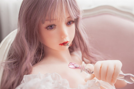 Adorable sex doll Chika showing her perfect boobies and bald twat in the bedroom
