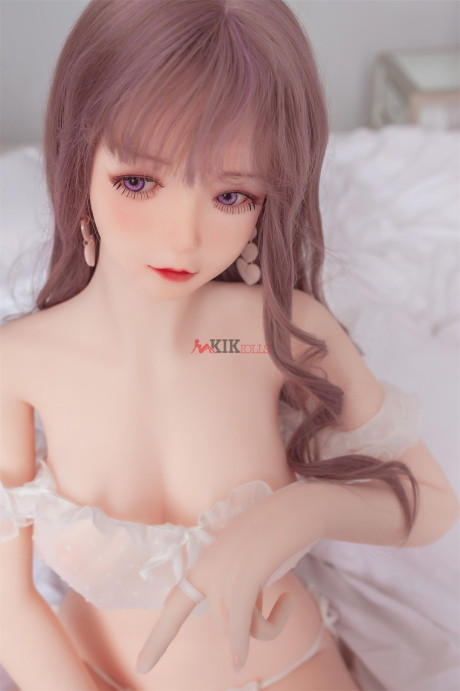 Adorable sex doll Chika showing her perfect boobies and bald twat in the bedroom