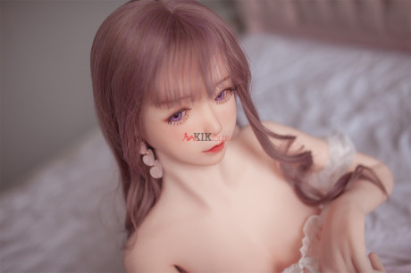 Adorable sex doll Chika showing her perfect boobies and bald twat in the bedroom