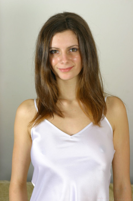 Dark-haired babe Martina loses her nightgown and shows her huge melons