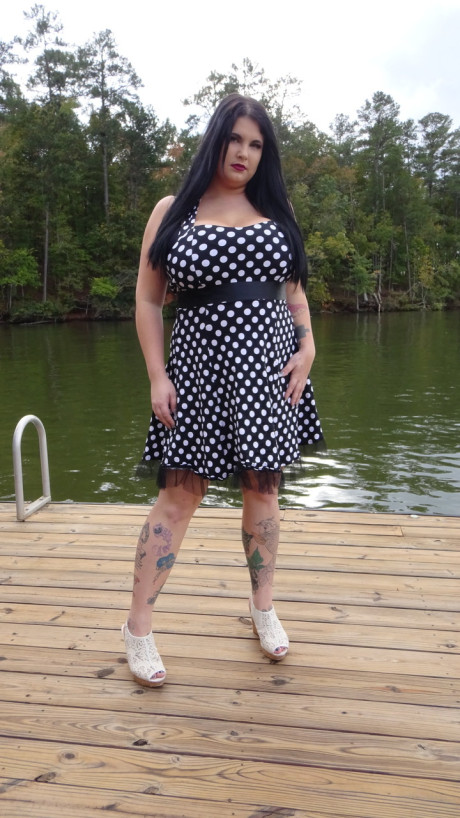 Dark haired chubby model Mischievous Kitty flashes her underwear in a solo