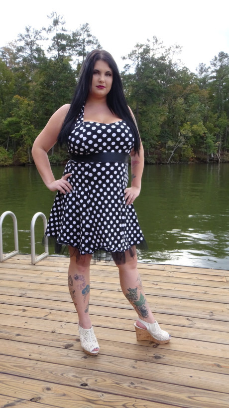 Dark haired chubby model Mischievous Kitty flashes her underwear in a solo