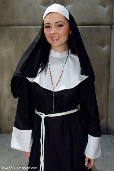 Sleazy nun with a divine behind Angell Summers strips and poses naked