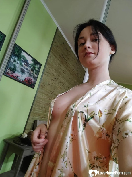 Attractive brunette babe in nylons flaunts her butt & takes selfies in the mirror