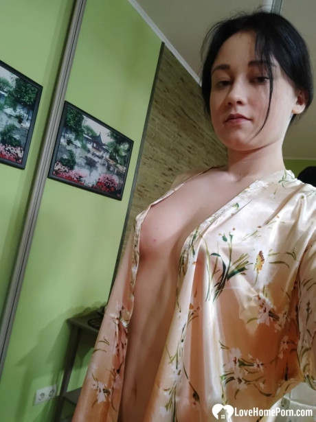 Attractive brunette babe in nylons flaunts her butt & takes selfies in the mirror