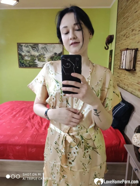 Attractive brunette babe in nylons flaunts her butt & takes selfies in the mirror