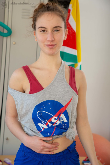 Lusty basketball player Giorgia strips undressed at the gym and shows her bush