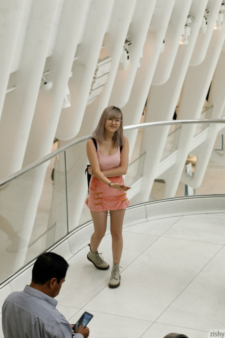 Nerdy chinese babe Barbie Qu flashing her melons and panties in public