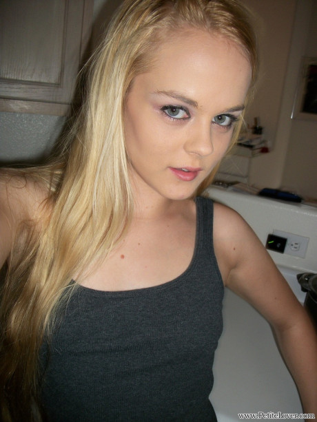 Thin amateur Bri Skies takes selfies while exposing her melons and pussy